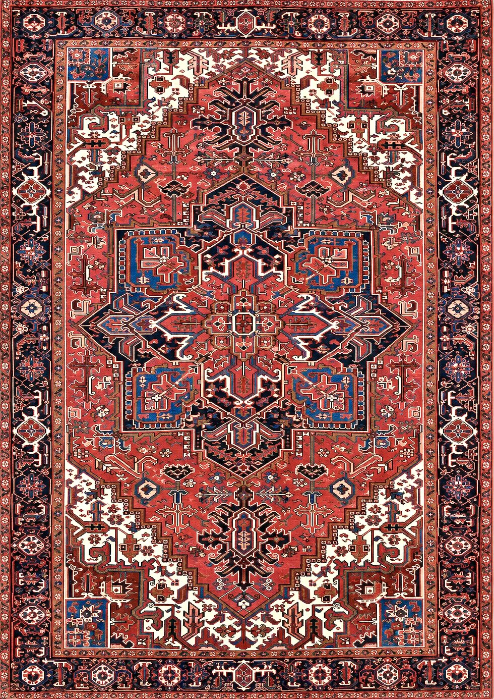 A traditional Persian Heriz rug with a red field, navy blue, beige, and cream patterns, and a decorative border.