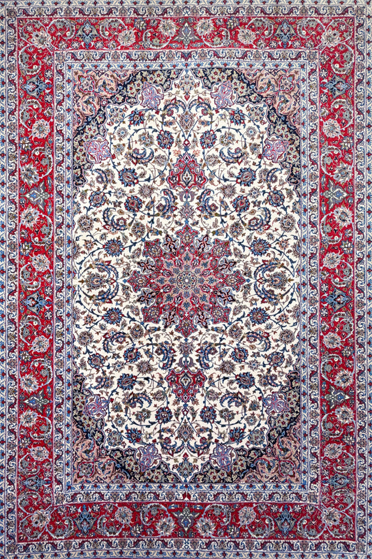 Hand-Knotted Persian Isfahan Rug, 6′9″x10′1″, with floral cream center, red border & intricate blue details.