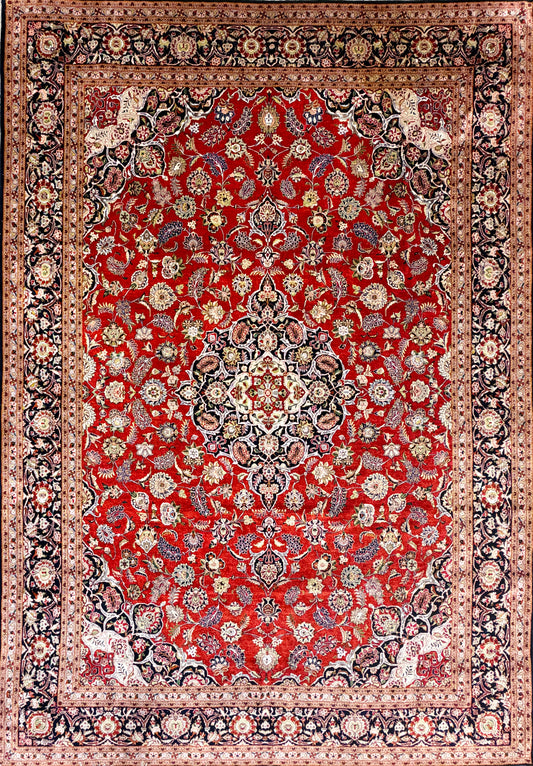 Hand-knotted 100% silk Persian Kashan rug, 6′10″x9′9″, with intricate red, cream & navy floral patterns.